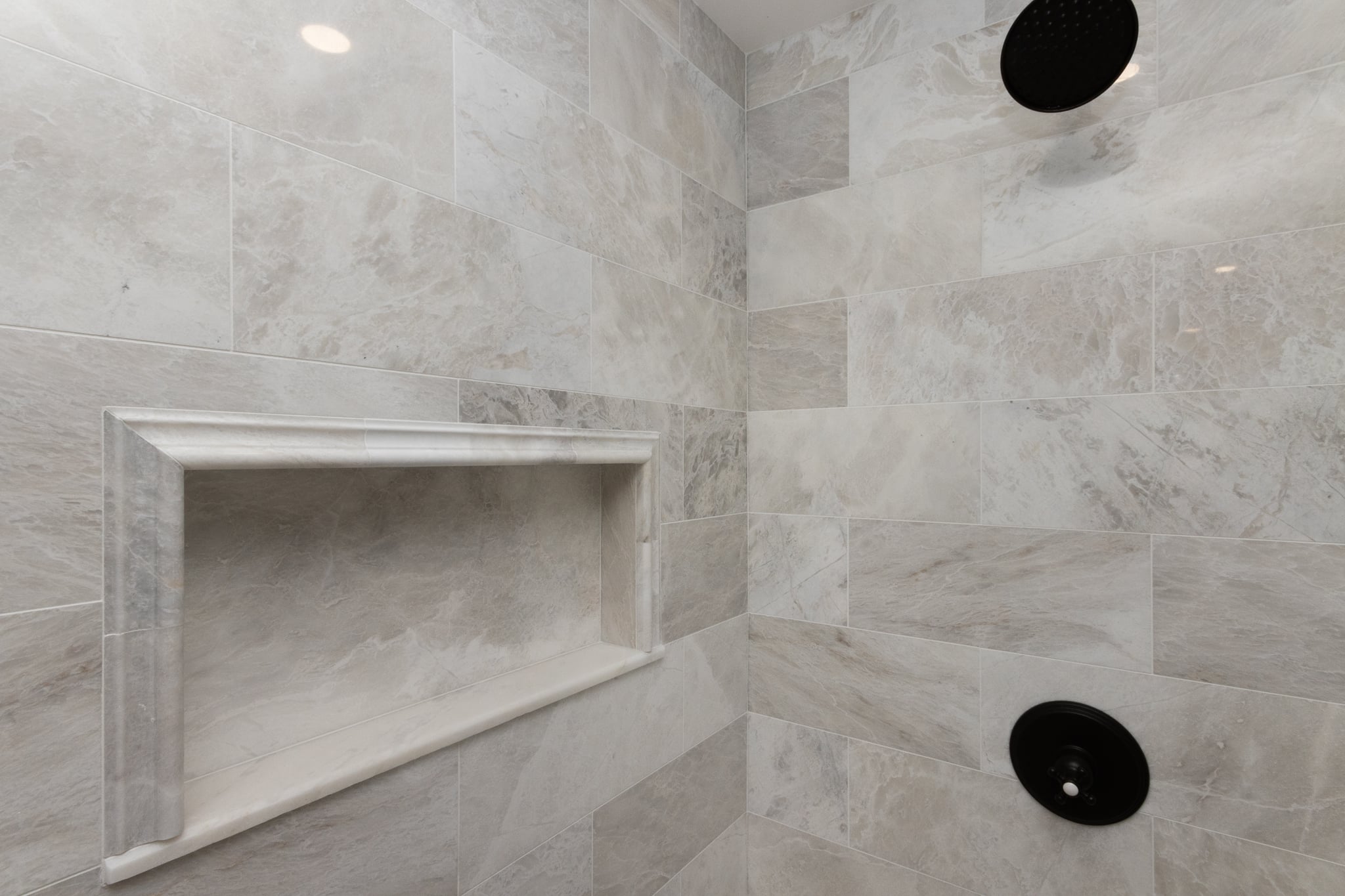 Freestanding bathtub in a renovated Newton MA bathroom designed and built by Bay State Remodeling