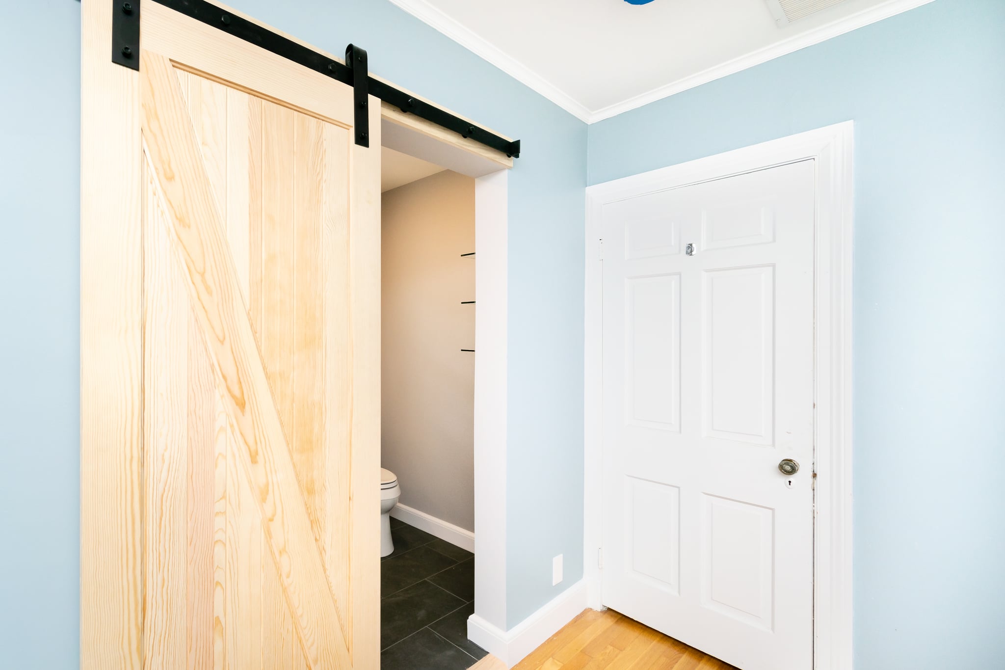 Before and after small bathroom remodel that maximizes space by Bay State Remodeling in Boston MA.